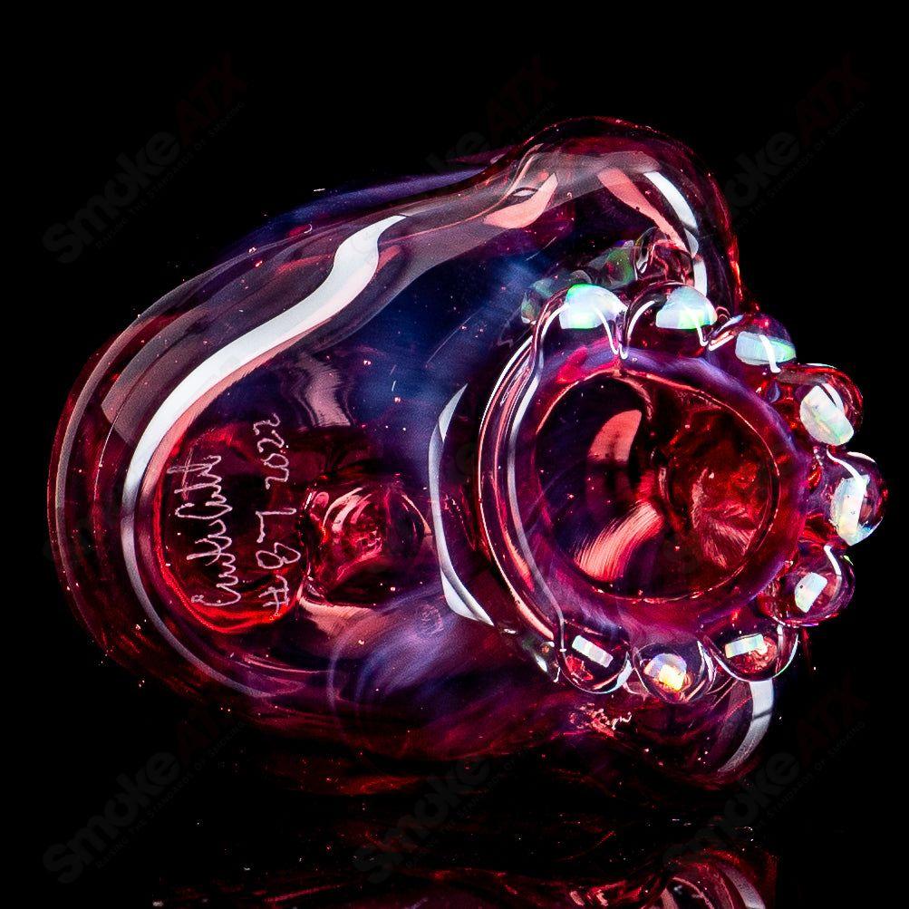 Carsten Carlile Skull Shredder heady glass concentrate rig with intricate skull design and clear glass accents.