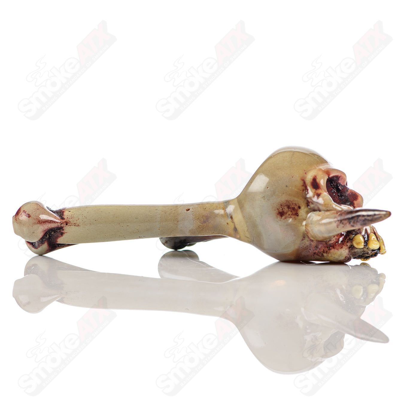 Handcrafted Ghost Glass skull spoon in clear glass, featuring intricate skull and ghost design, perfect for heady glass enthusiasts.