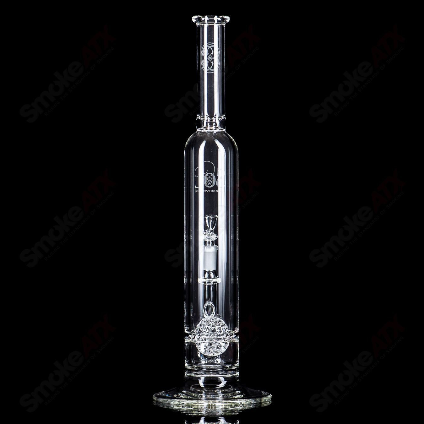 Glass waterpipe with intricate lace-sphere design by SoL Glassworks, featuring clear glass construction and artistic detailing.
