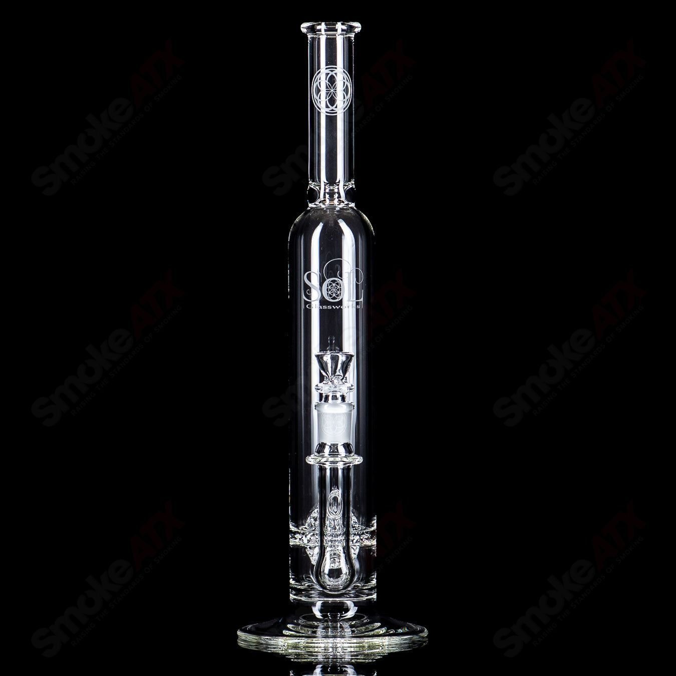 Glass waterpipe from SoL Glassworks featuring a lace-sphere design with clear and colorful glass details.
