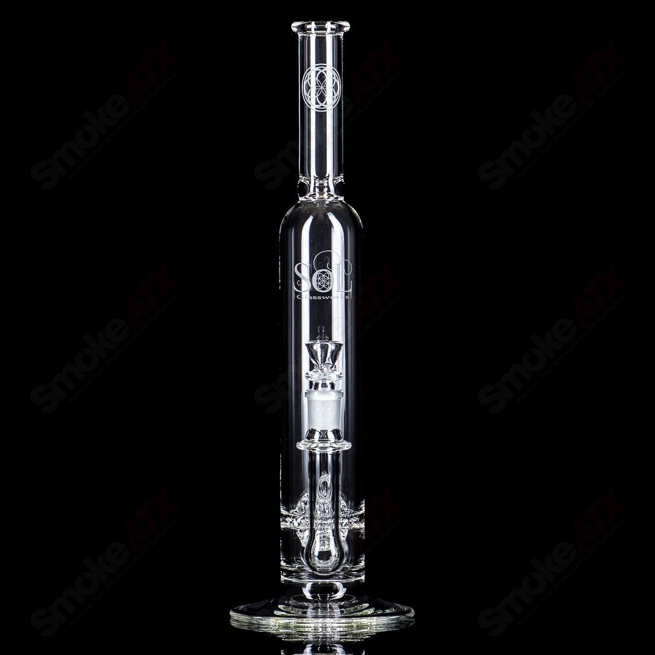 Glass waterpipe with a lace-sphere design by SoL Glassworks, featuring clear glass construction and intricate detailing.