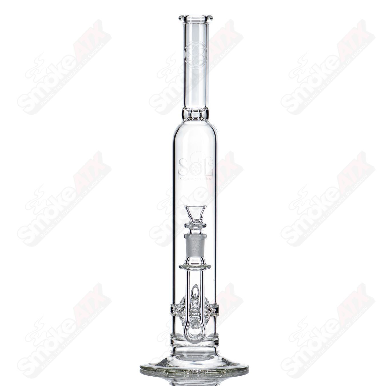 Clear glass waterpipe with a lace-sphere design by SoL Glassworks, featuring intricate patterns and a sleek, modern shape.