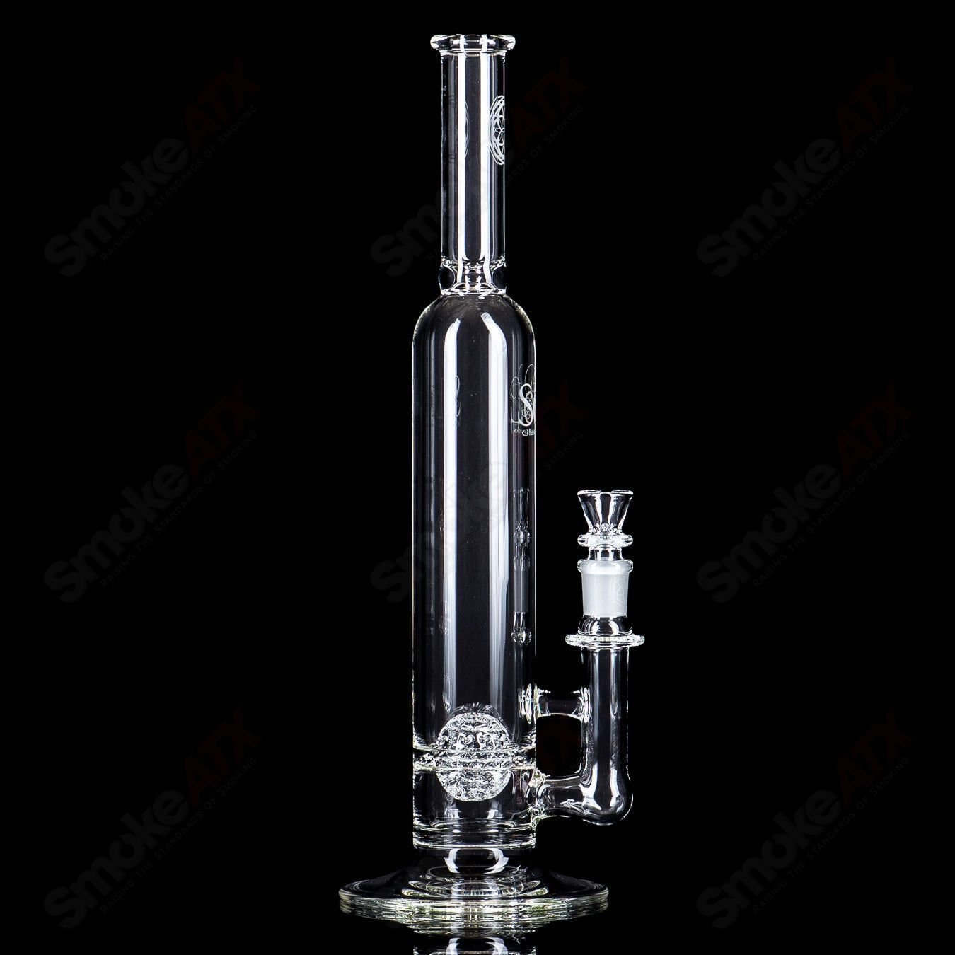 Clear glass waterpipe with a decorative lace-sphere design by SoL Glassworks, featuring intricate glasswork and a smooth shape.
