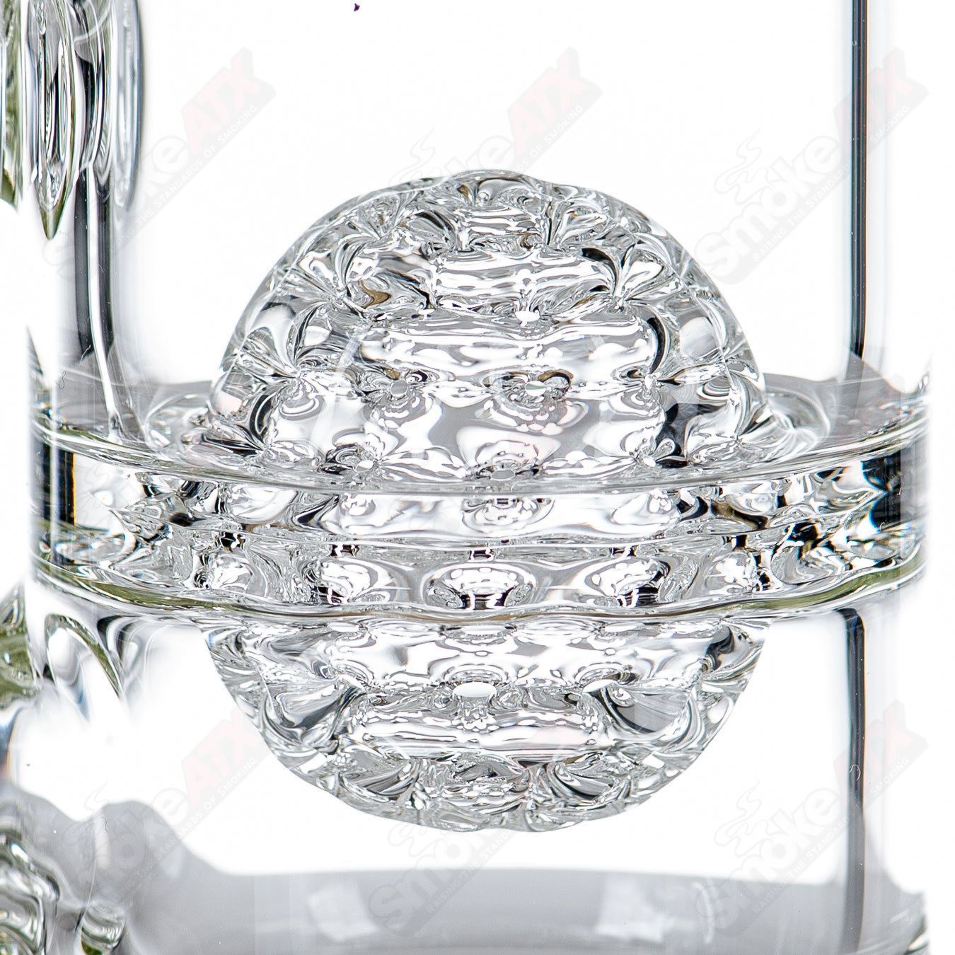 Lace-sphere glass waterpipe by SoL Glassworks featuring intricate lace patterns and clear glass design.