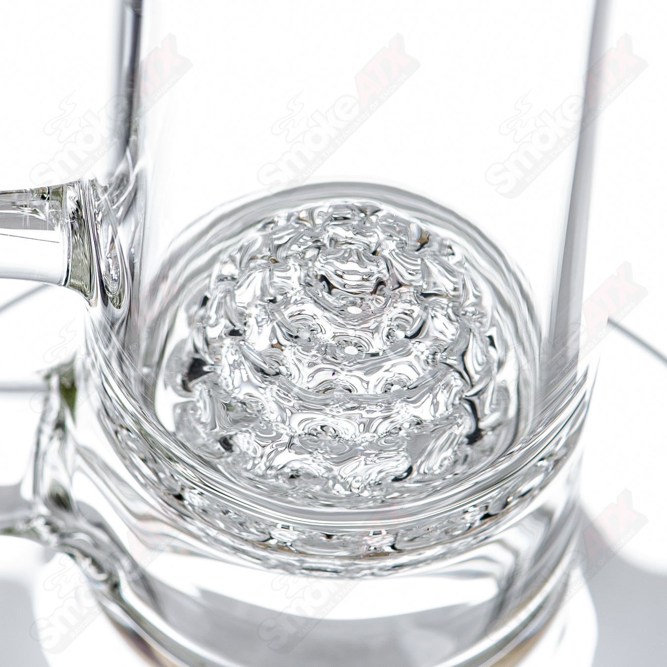 Glass waterpipe with a decorative lace sphere design by SoL Glassworks, featuring intricate glass craftsmanship and vibrant colors.