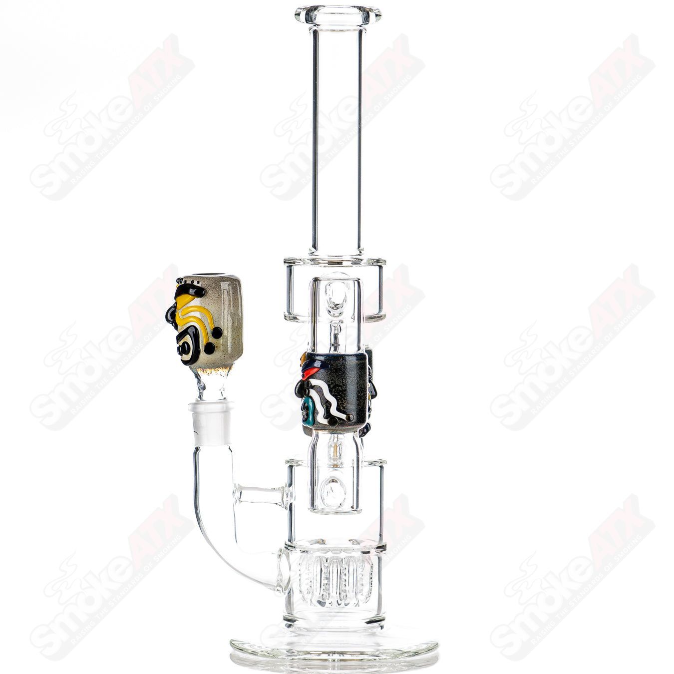 Spinning Tiki Head Scientific Tube by Carsten Carlile and Dirty Rico Glass, featuring intricate tiki head design and clear scientific glass.