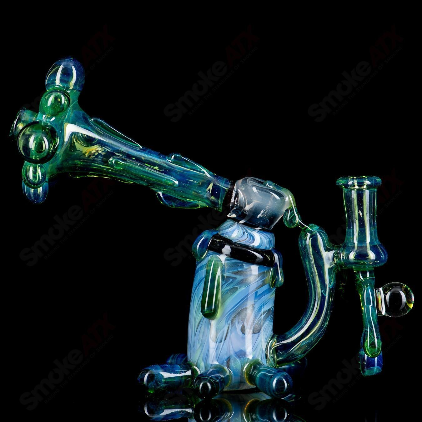 King Leo Spray Paint Can Rig, a colorful glass concentrate rig designed like a spray paint can for dabbing and vaporizing concentrates.
