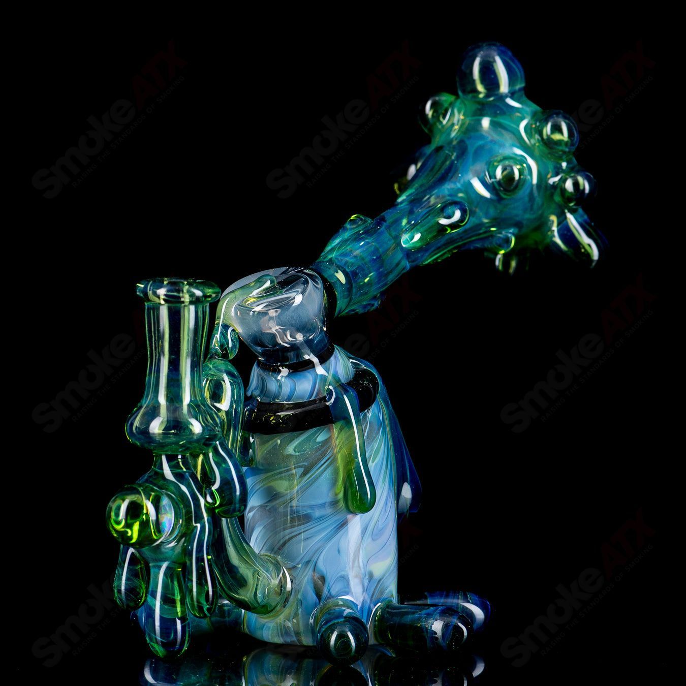 King Leo Glass spray paint can rig, a colorful heady glass concentrate rig with detailed spray paint can design.