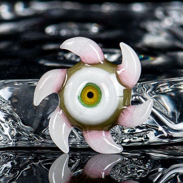 Heady glass Starefish Spanish Olive SALT container by Salt Glass, featuring a colorful, artistic fish design.