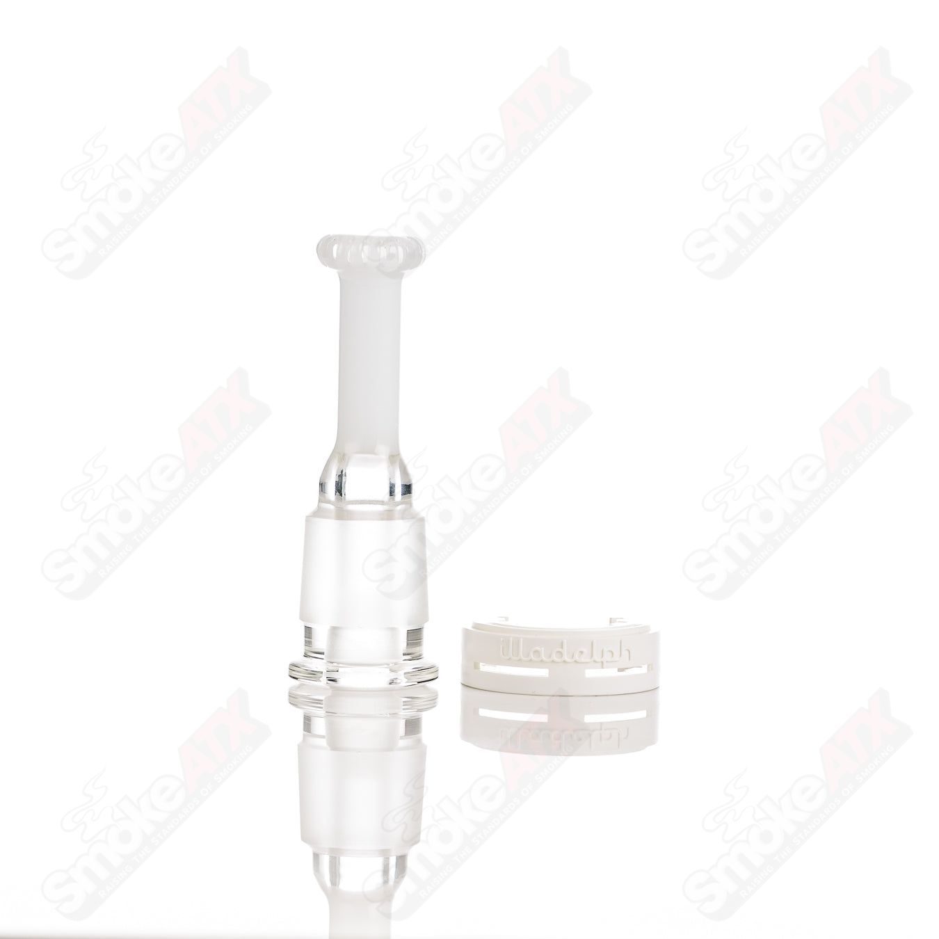Teal glass disc ash catcher by Illadelph, designed for smoking pipes, with a clear glass connection and intricate pattern details.
