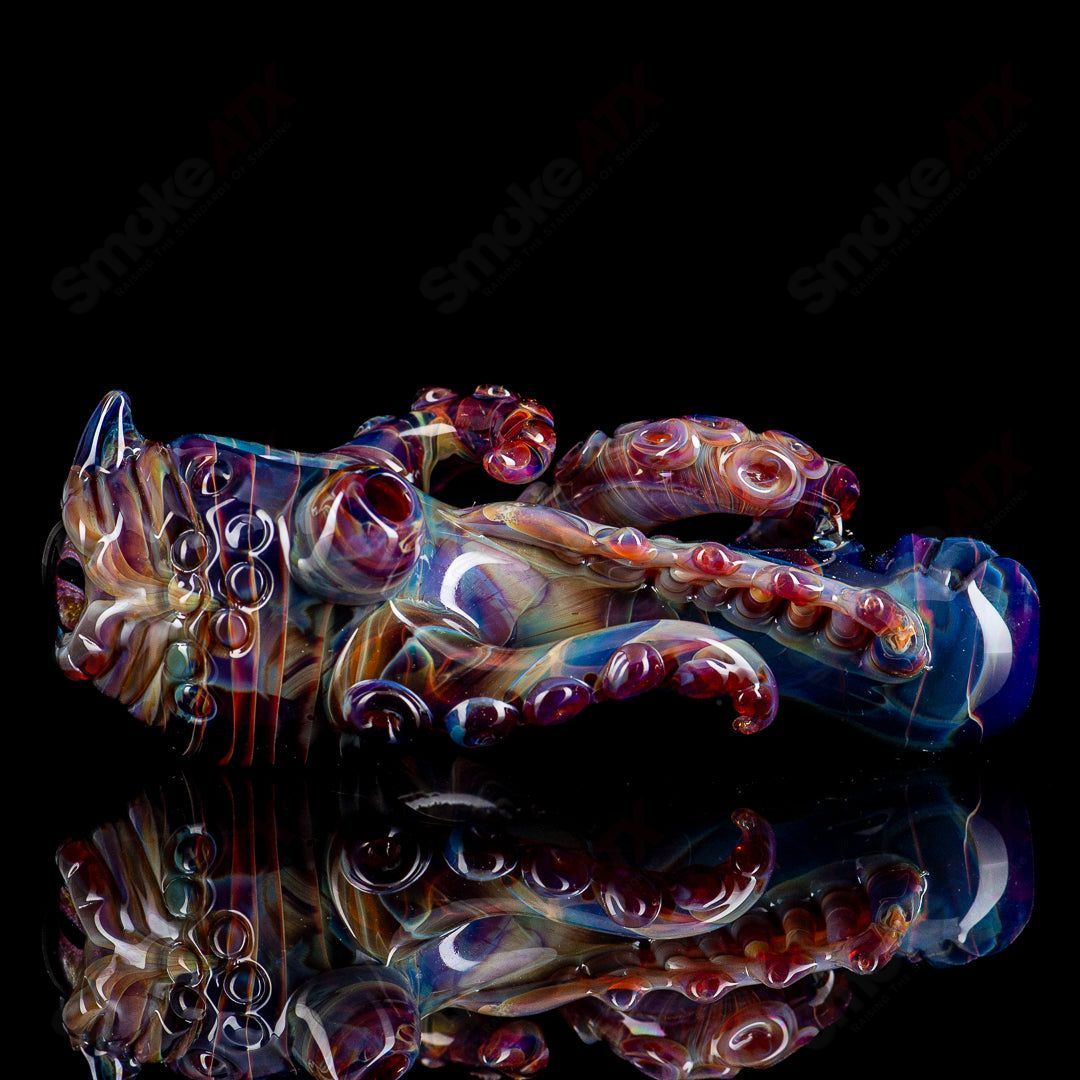 Mako Glass #4 Seamonster spoon hand pipe with intricate glass design and vibrant colors, showcasing detailed craftsmanship.