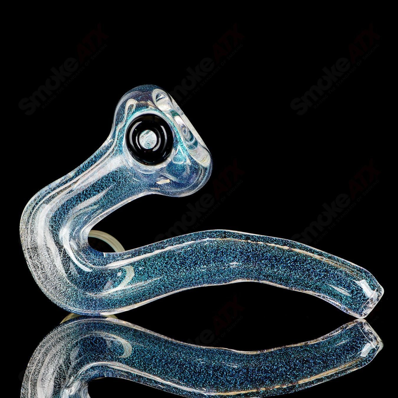 Transparent Dichro Sherlock glass by JMK Glass featuring a signed Sherlock design with vibrant, shifting dichroic colors.