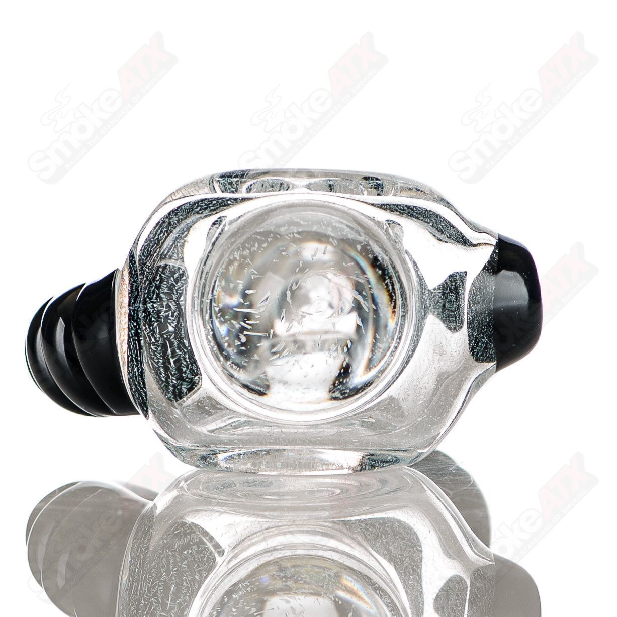 Transparent dichro spoon pipe with black horn accents, signed by JMK Glass, featuring colorful, iridescent glass detailing.