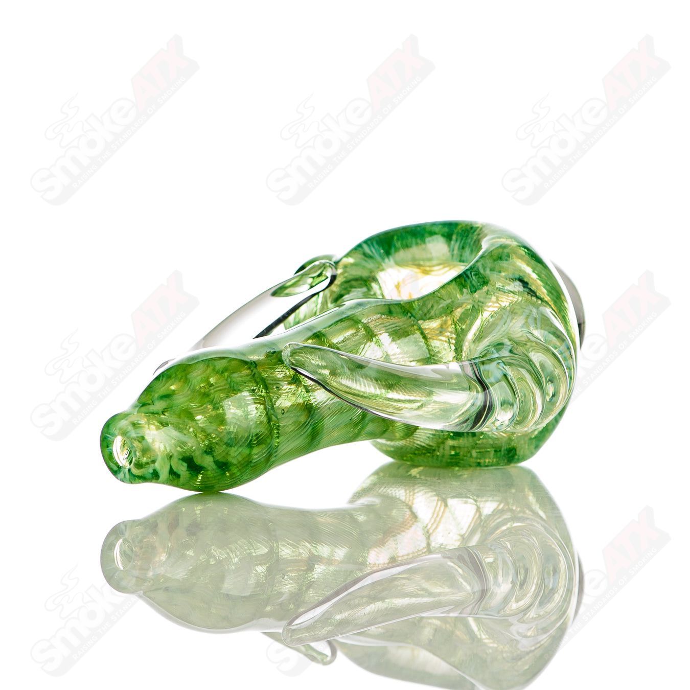 Transparent green I/O coil spoon pipe with clear horn accents, signed by JMK Glass, a hand pipe from their heady glass collection.
