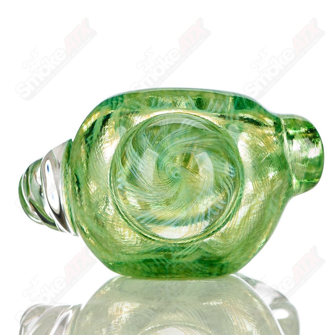 Transparent green I/O coil spoon hand pipe by JMK Glass with clear horn accents and signature detailing.
