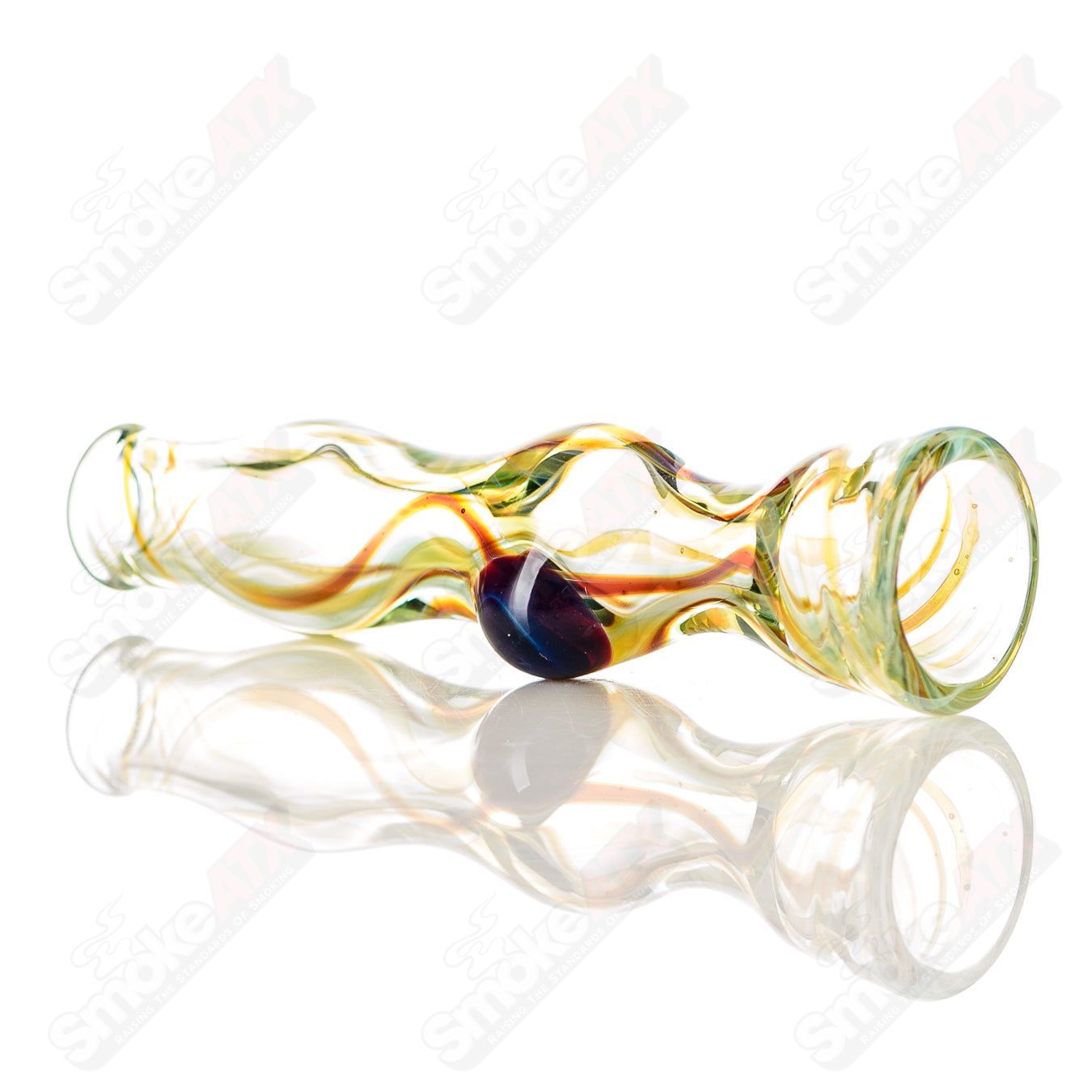 Transparent yellow and orange worked glass chillum by Indo Glass, showcasing intricate patterns and smooth glass texture.