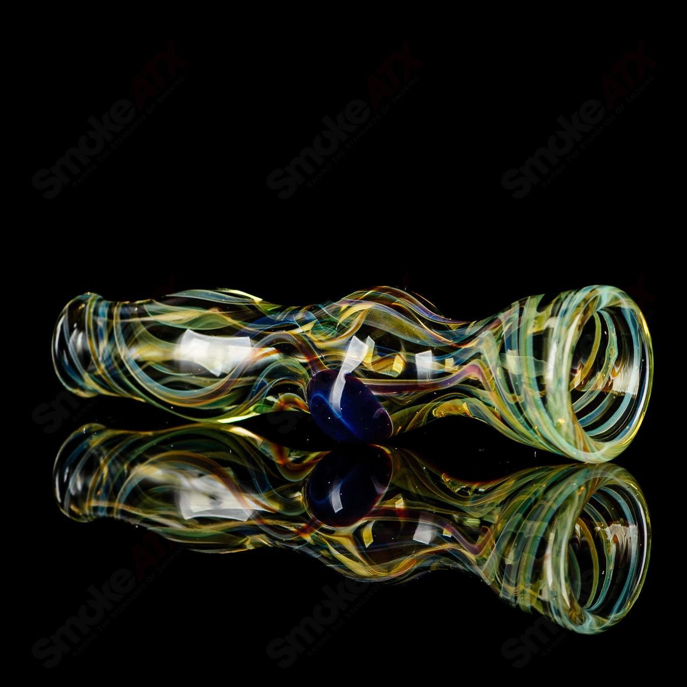 Transparent yellow and orange worked Indo Glass chillum, made of glass with intricate designs and a compact smoking pipe shape.
