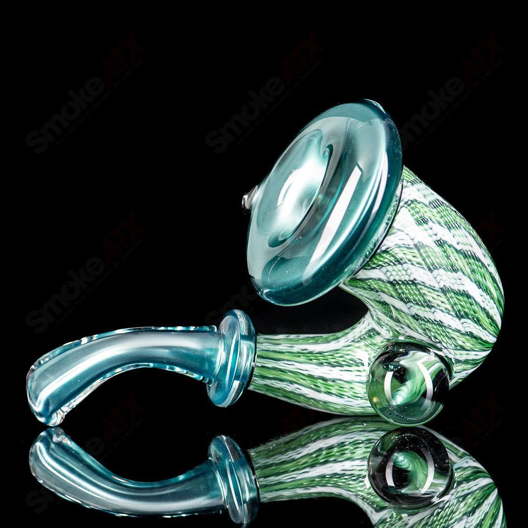 Neptunium Sherlock glass by JMass, featuring a detailed Sherlock-style design with clear glass and intricate artwork.