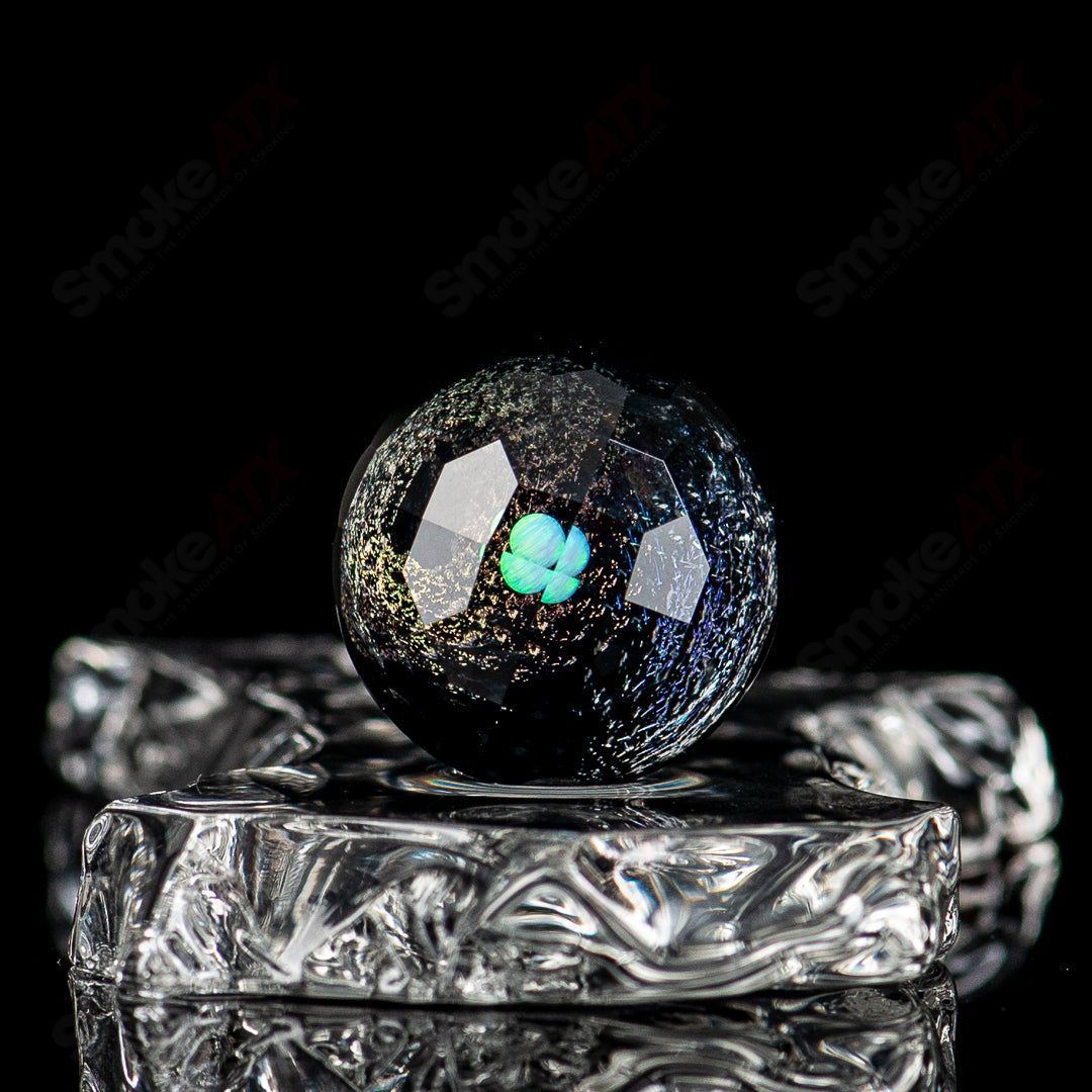 Fatal Facets marble from the Eric Mort x Fatal Facets collab, featuring intricate marble design on a heady glass piece.