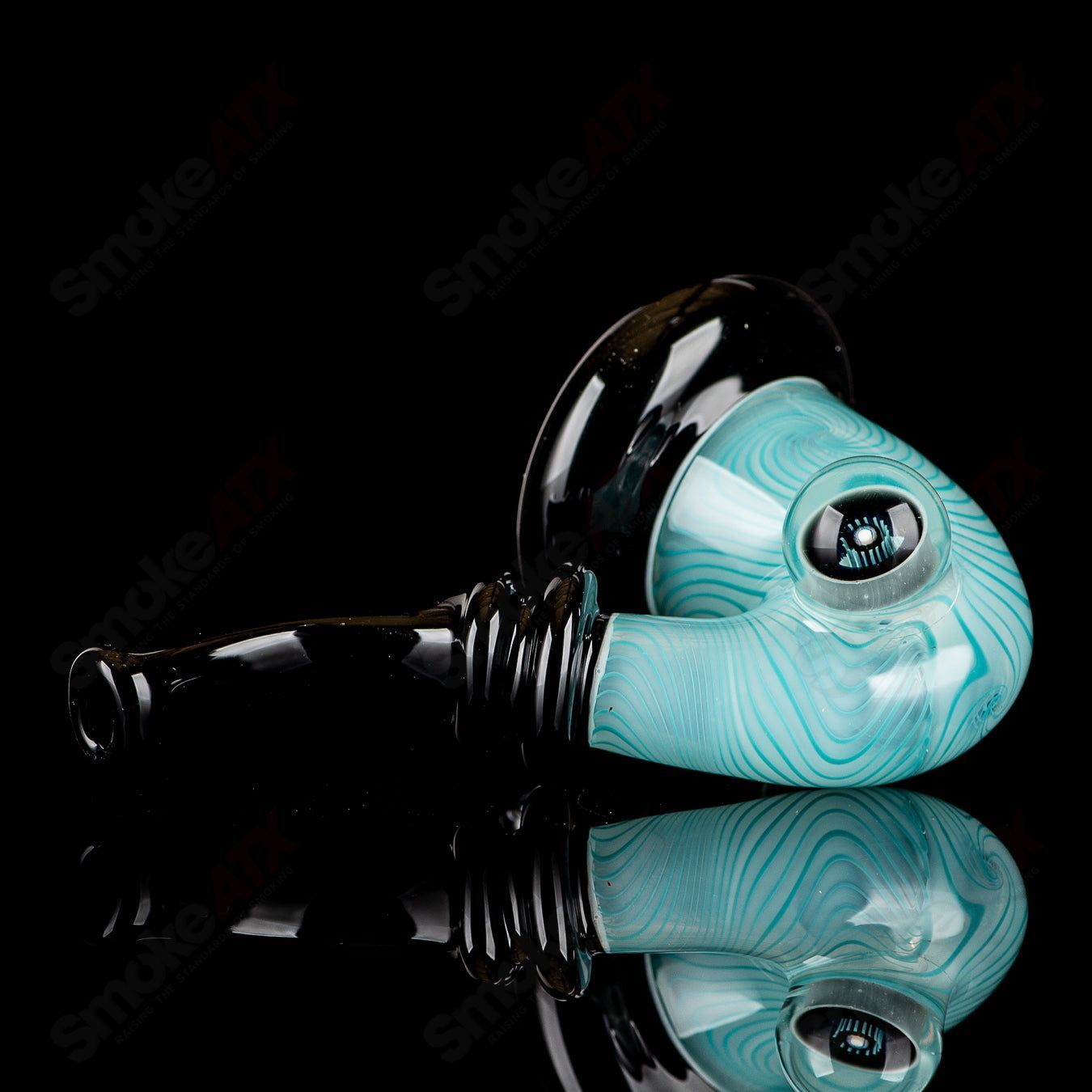 UV Aqua Linework Sherlock glass pipe by JMass, featuring vibrant blue and green linework design on a Sherlock style heady glass pipe.