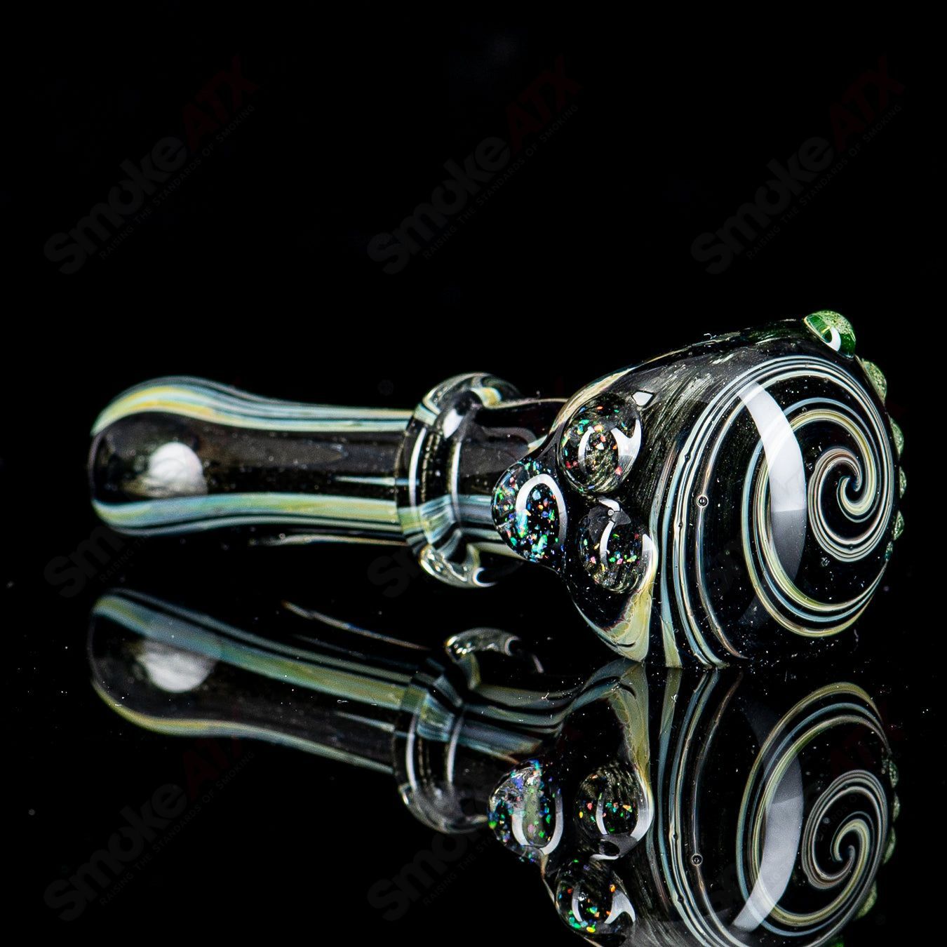 UV black hand pipe with crushed opal design by JMass, featuring vibrant colors and a sleek, ergonomic shape for easy use.