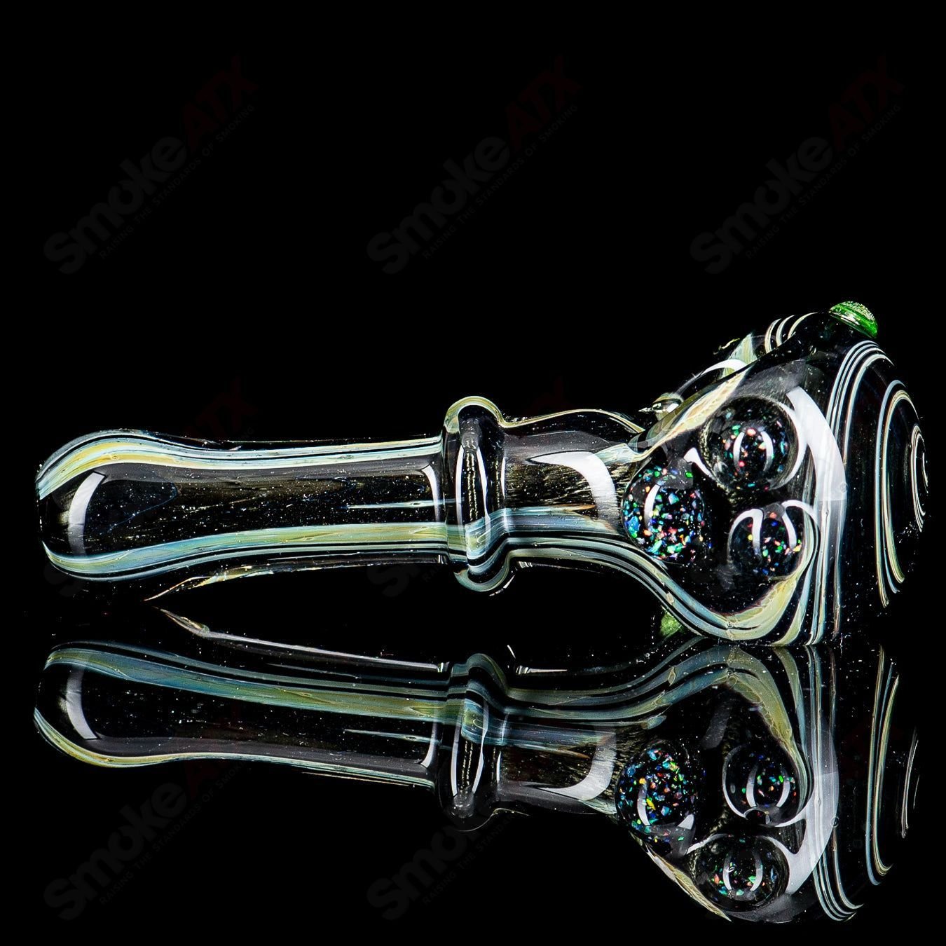 UV black hand pipe with crushed opal accents by JMass, featuring a sleek spoon design in vibrant glass art.