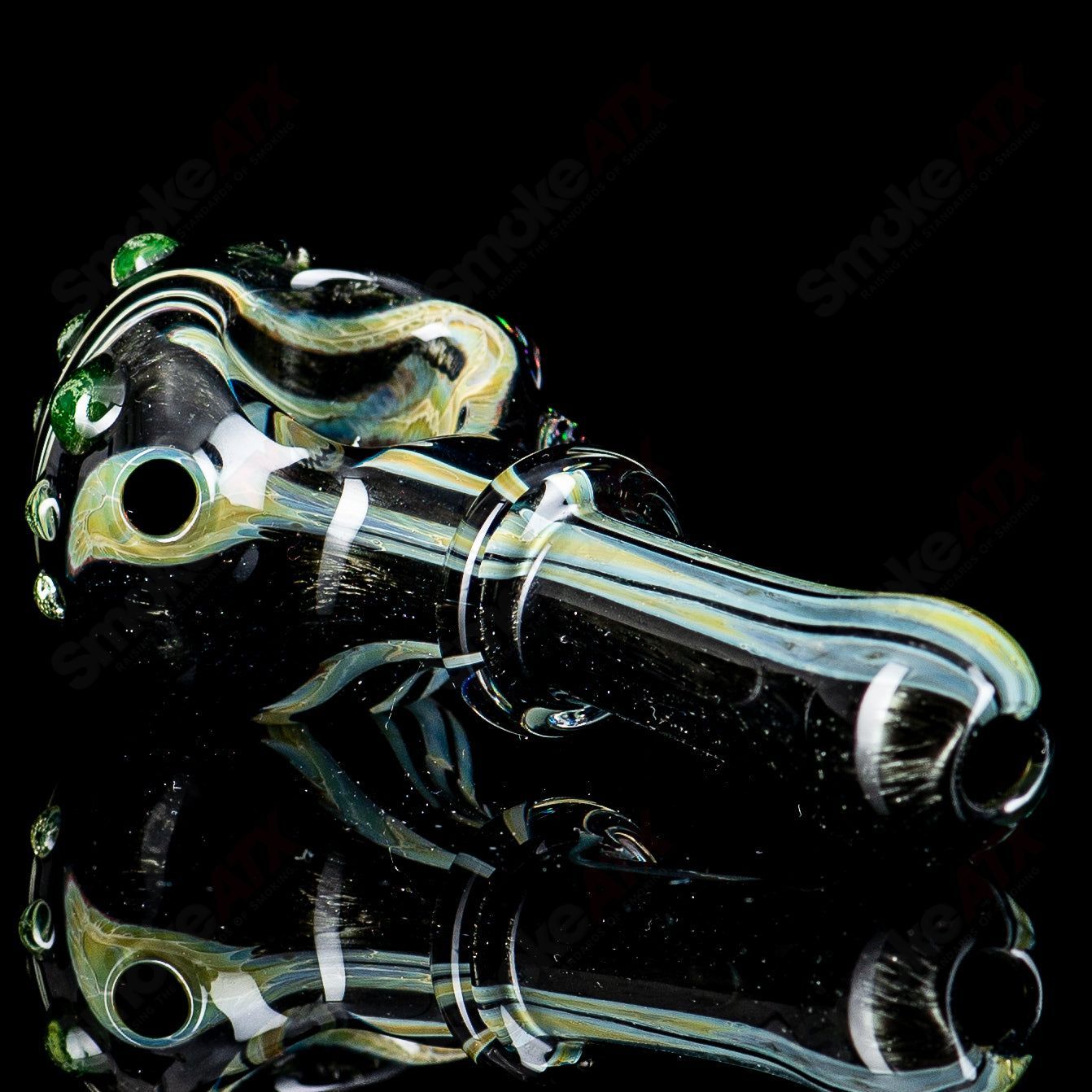 UV black hand pipe with crushed opal accents by JMass, featuring a sleek spoon design in heady glass.