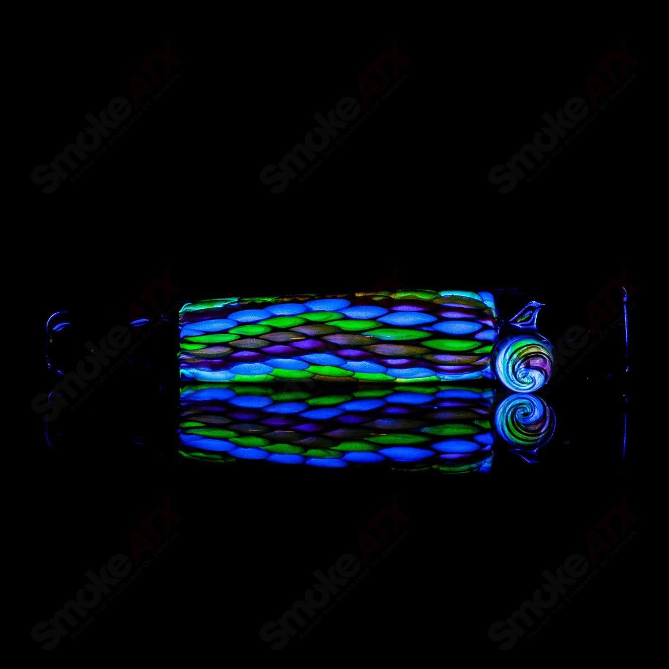 UV Chillum BCM Glass heady glass chillum with vibrant UV-reactive design and clear glass construction.