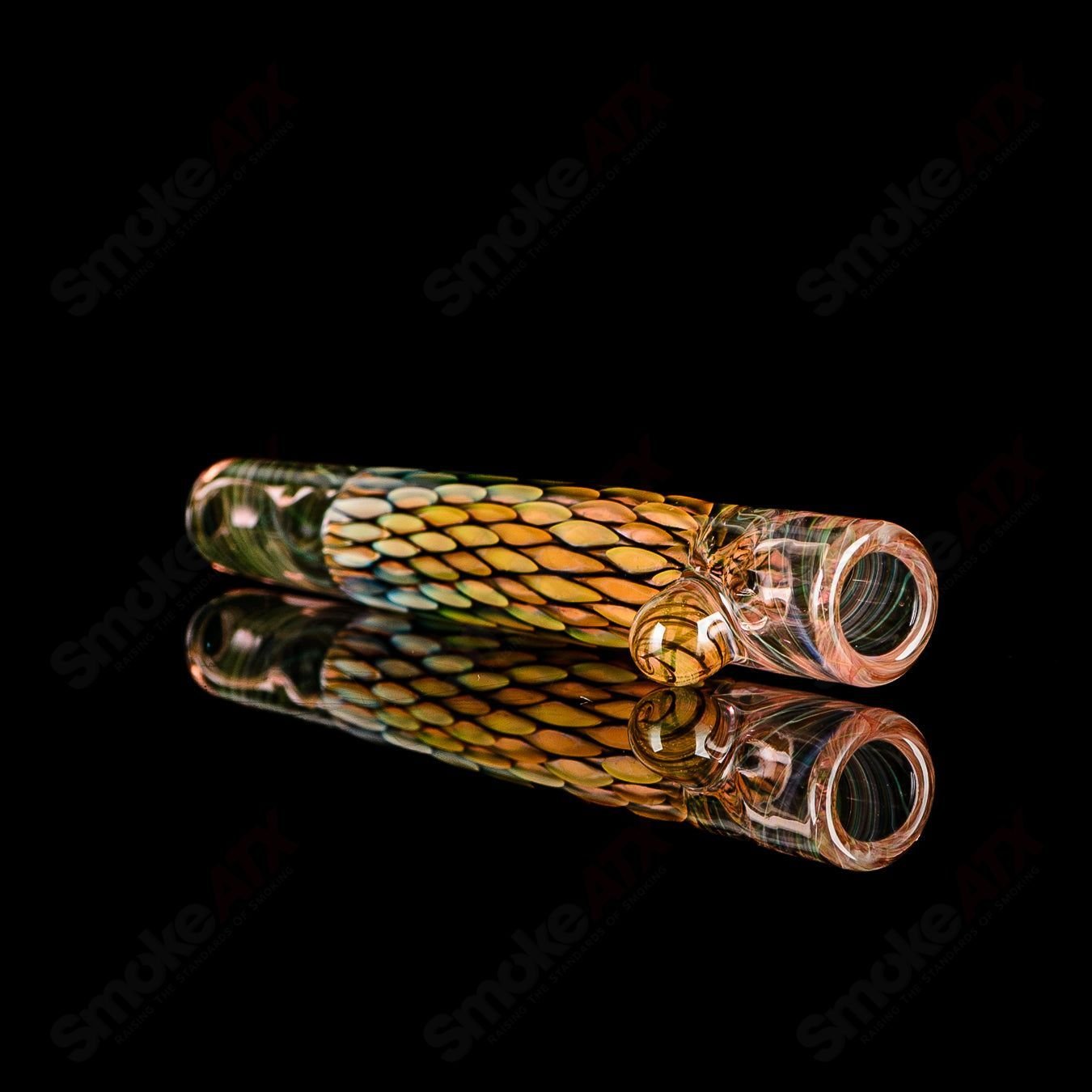 Colorful UV-reactive BCM Glass Chillum, heady glass piece with vibrant designs, designed for smooth smoking experience.