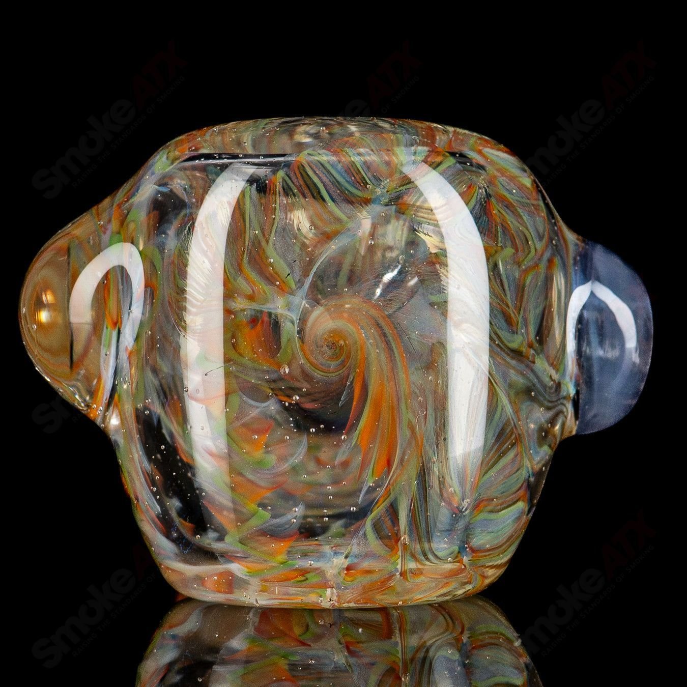 UV Inside Out Rainbow Spoon by JMK Glass, a colorful hand pipe with vibrant rainbow and UV-reactive glass details.