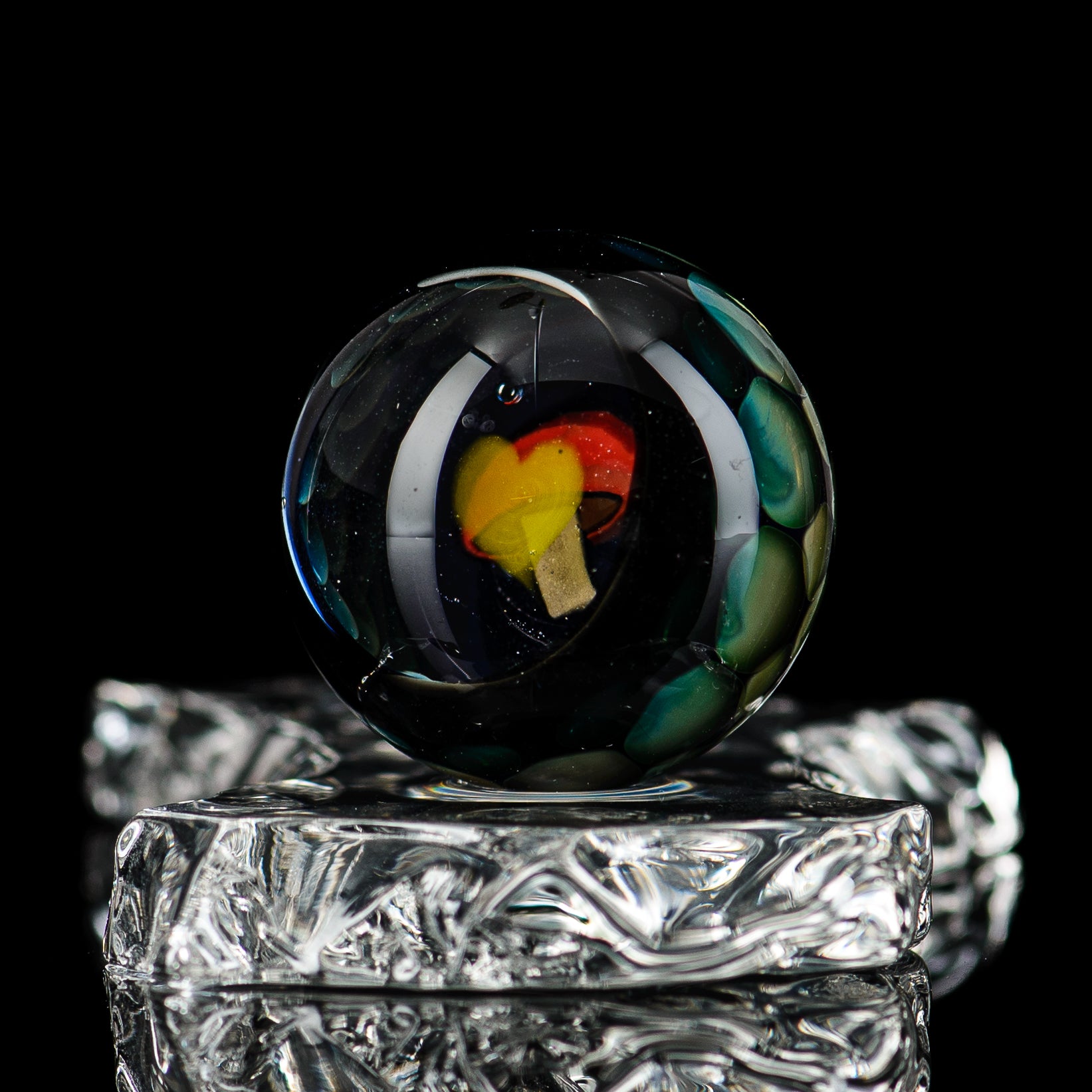 Colored marble glass balls from Flex Glass, showcasing smooth, shiny marbles with a marble pattern in various colors.