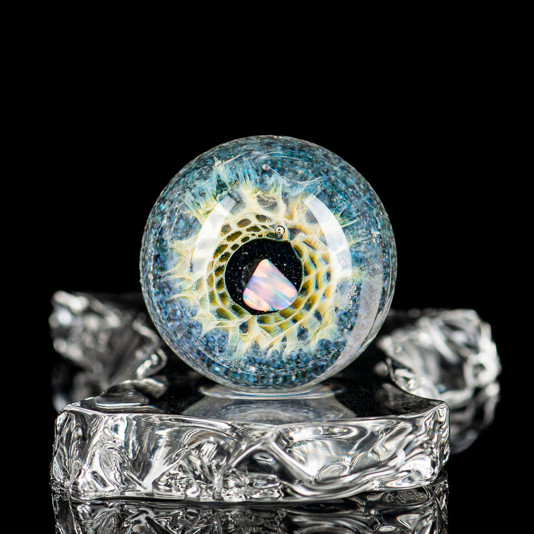 Indo Glass Dichropal Eye Mib heady glass with colorful marbles, featuring intricate glasswork and vibrant design details.