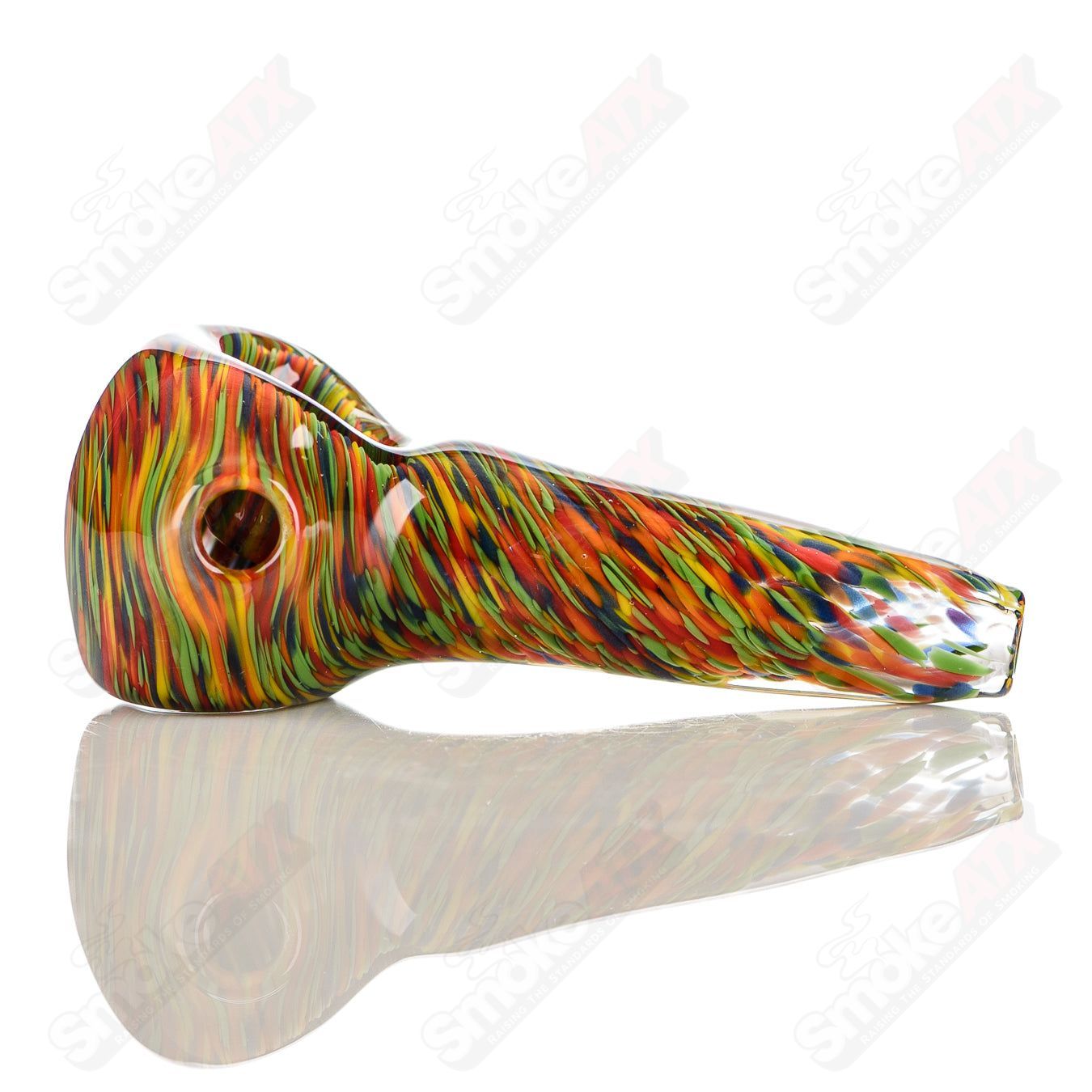 Signed JMK Glass rainbow swirl glass spoon pipe with colorful worked pattern and smooth finish for smoking use.
