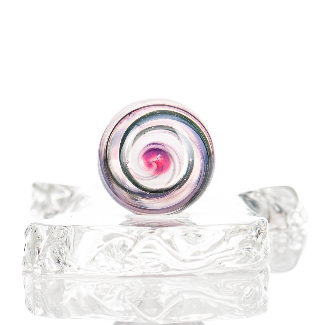 Colorful UV Spiral Mib Indo Glass marble with vibrant swirl patterns, crafted by Indo Glass, designed for collectible marble enthusiasts.