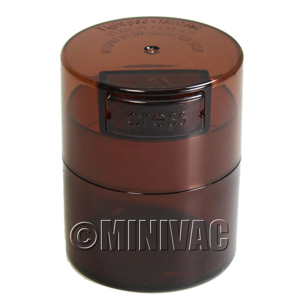 Mini TightVac Storage Container in clear plastic, 1.4oz capacity, ideal for food or small item storage.