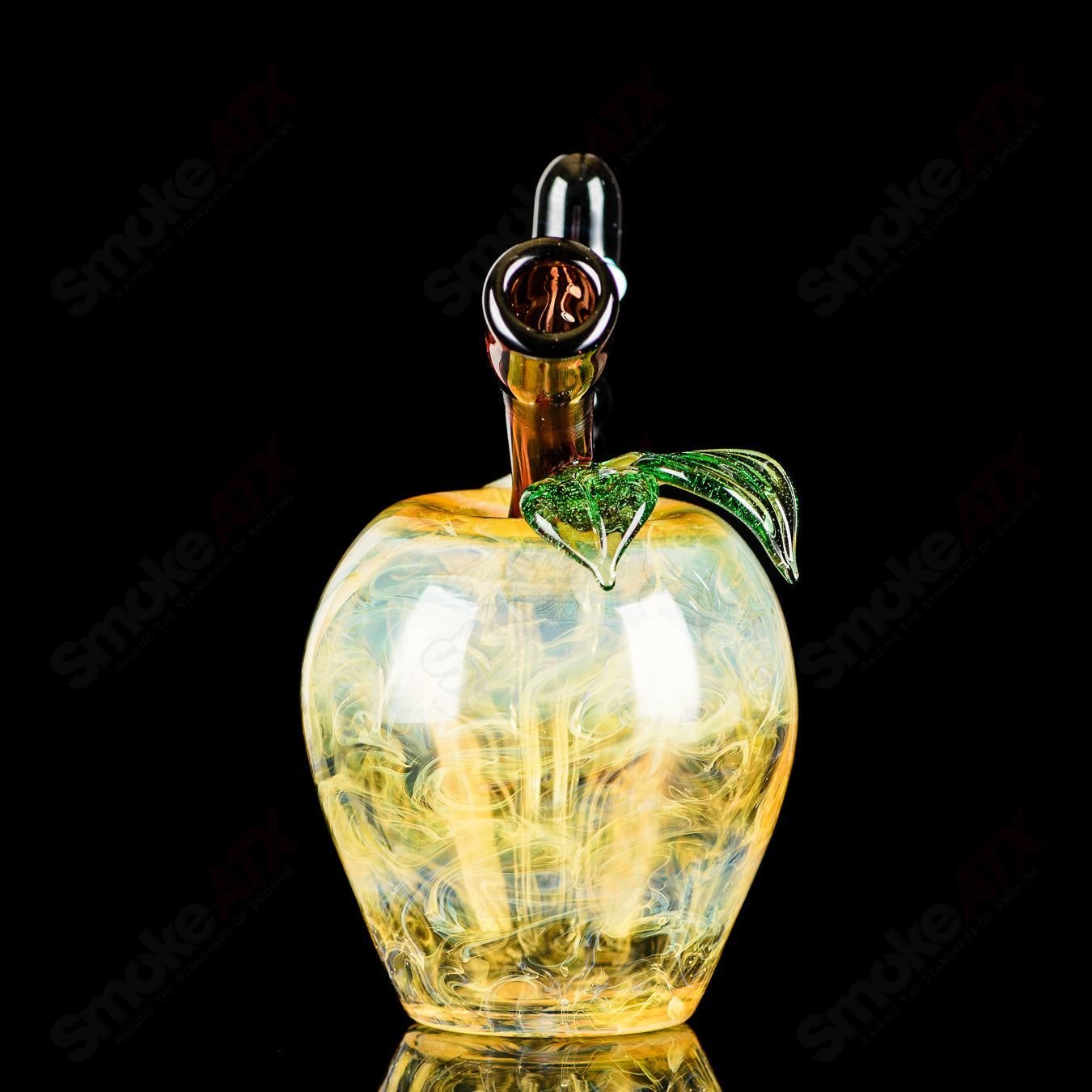 Yellow apple-shaped rig with a worm dabber pouch, made of glass, by Pouch Glass, used for concentrates in heady glass collection.