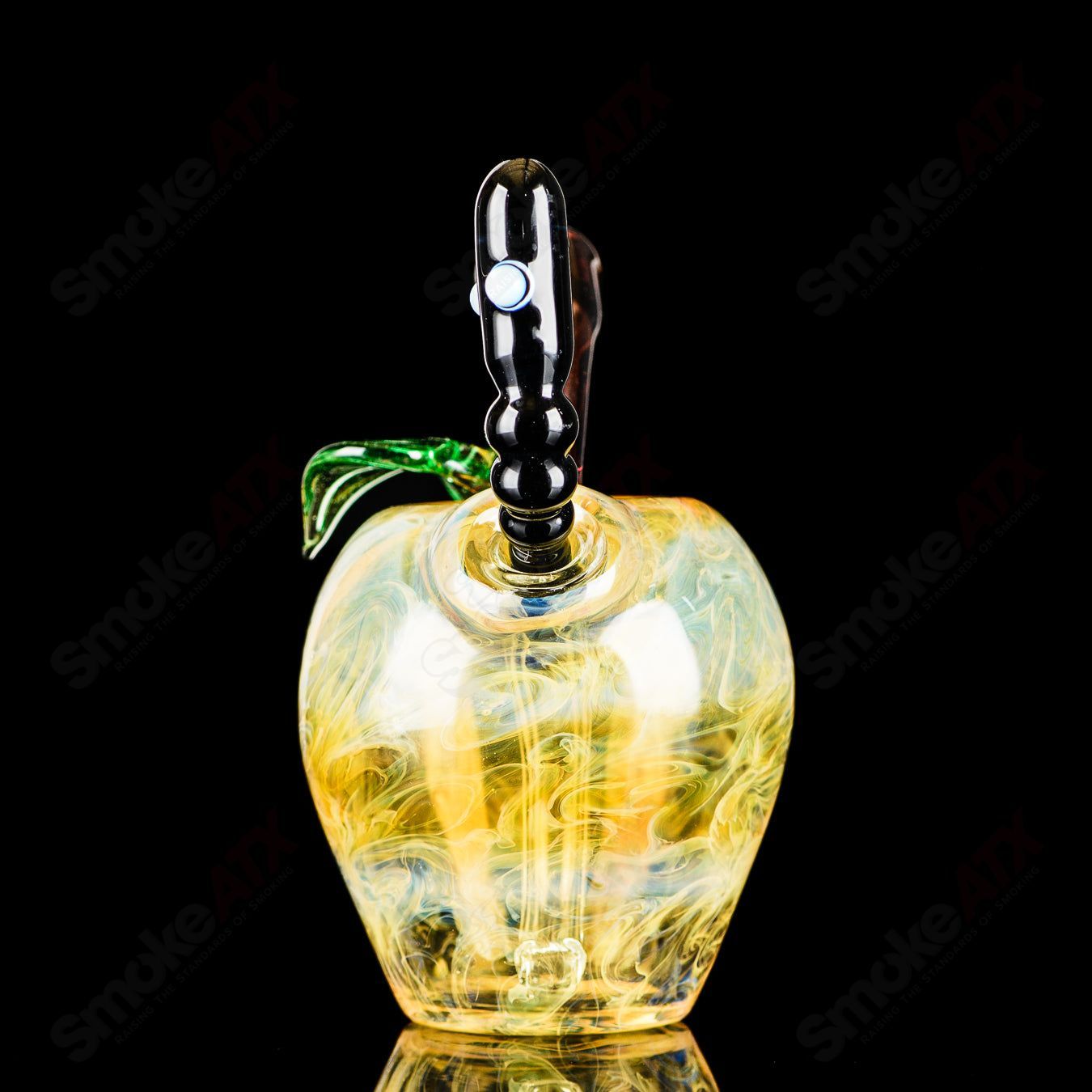 Yellow apple-shaped rig with a worm dabber pouch from Pouch Glass, designed for concentrate use, featuring vibrant glass art.