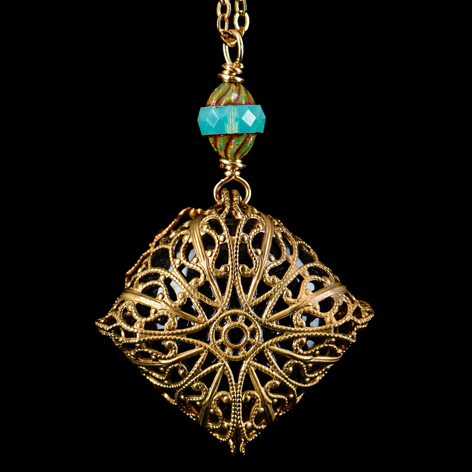 Glass pendant necklace with UV dot brass pendant on chain, designed by Pake, showcasing a modern, stylish jewelry piece.