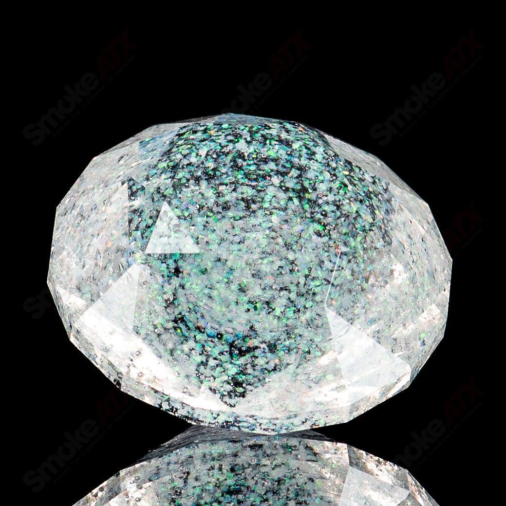 Crushed opal gem marbles by Fatal Facets, featuring vibrant, colorful glass with intricate internal patterns and a glossy finish.