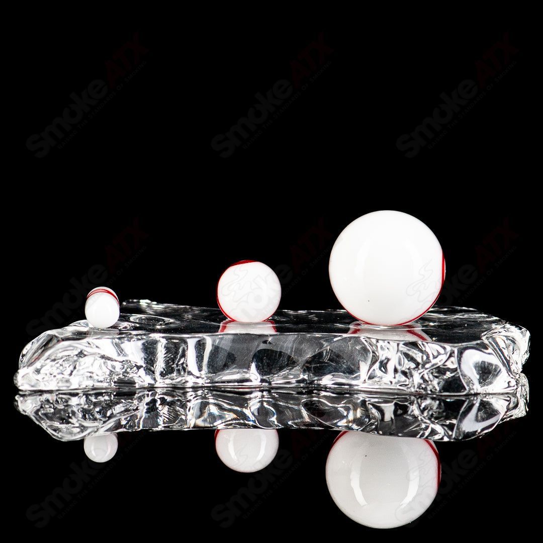 Three-piece Pokeball Terp Slurper Set by Ganja Grimmlin Glass, featuring colorful glass terp slurper tools and containers.