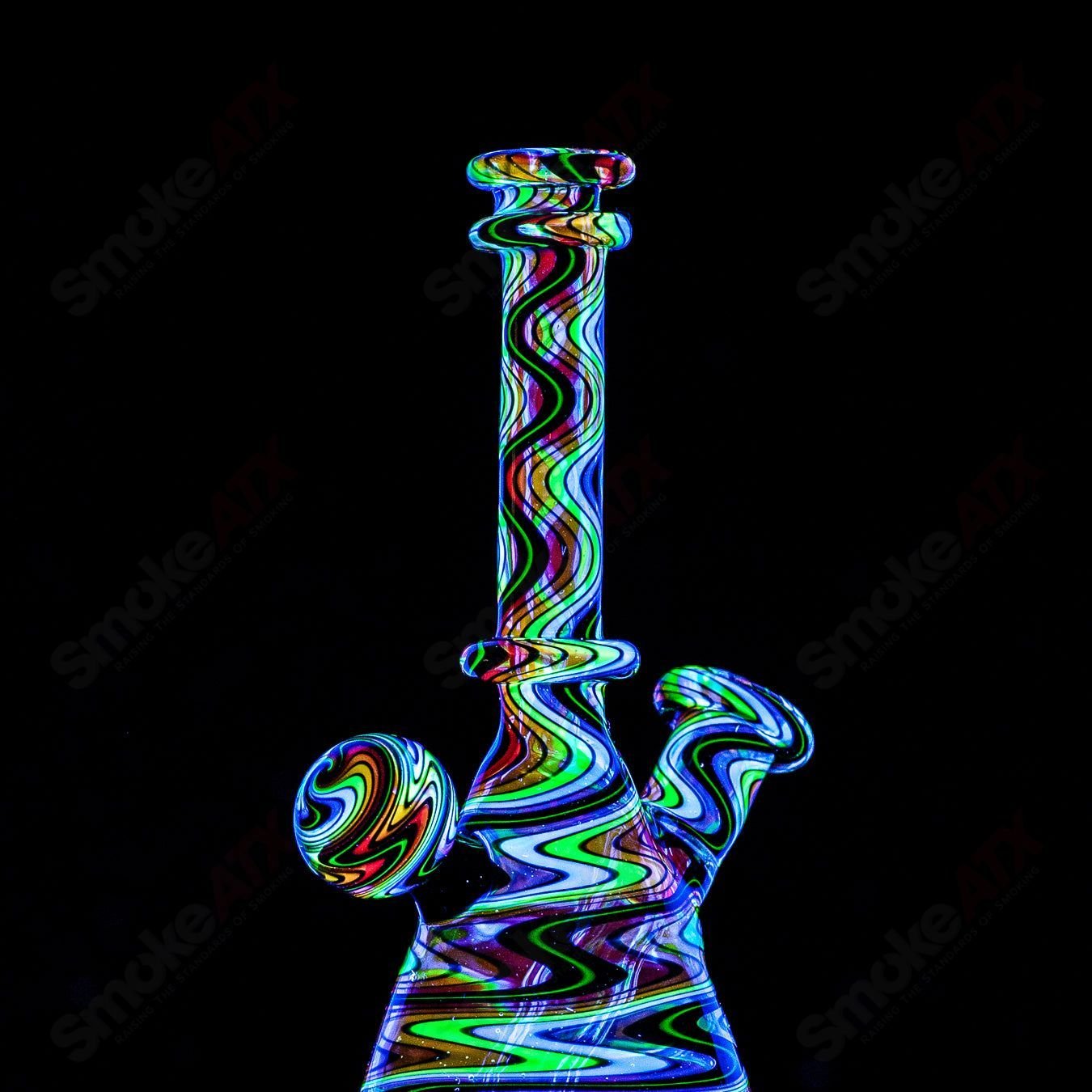 Dustorm Glass 10mm UV Secret Rainbow Mini Tube waterpipe with vibrant rainbow detailing and clear glass construction.