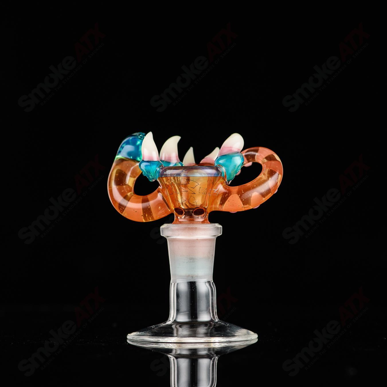 UV reactive 14mm 3-hole slide bowl by Salt Glass, designed for Heady Glass pipes with colorful, glowing features.