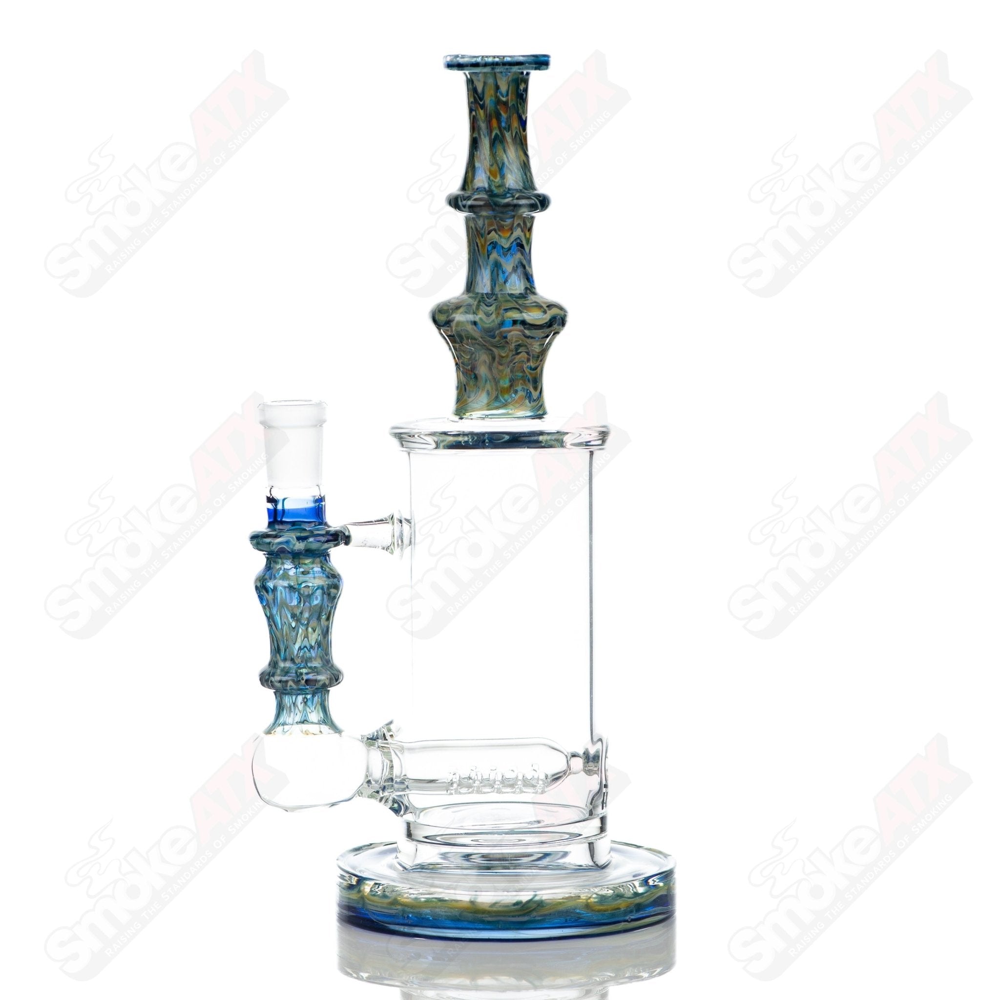 Tagle Glass 14mm 60mm Wrap n Rake Inline Tube waterpipe made of clear glass with intricate design details.
