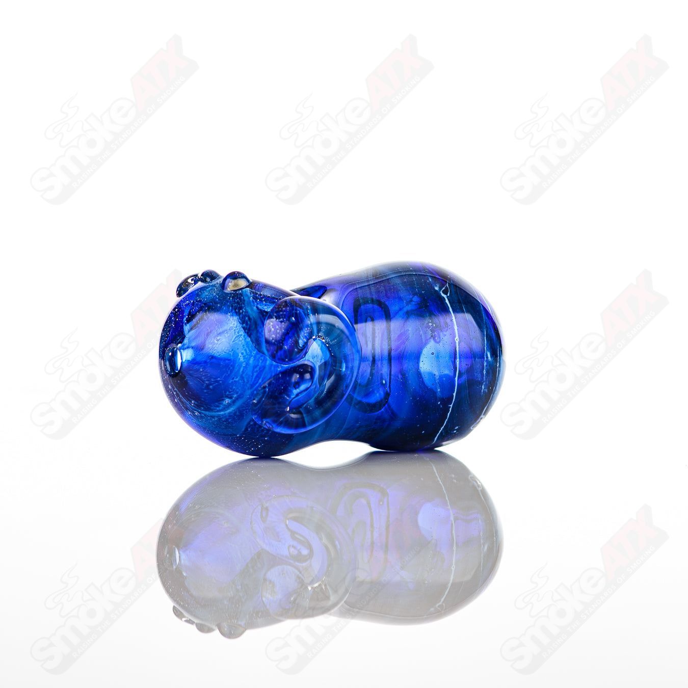 Glass pipe called the Bean Spoon by Nobody, featuring a clear glass design with a rounded bean shape and smooth mouthpiece.