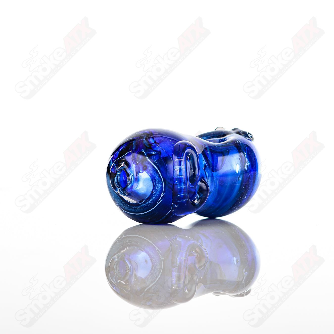 Glass pipe called Bean Spoon by Nobody, clear glass with a smooth, rounded shape, designed for smoking.