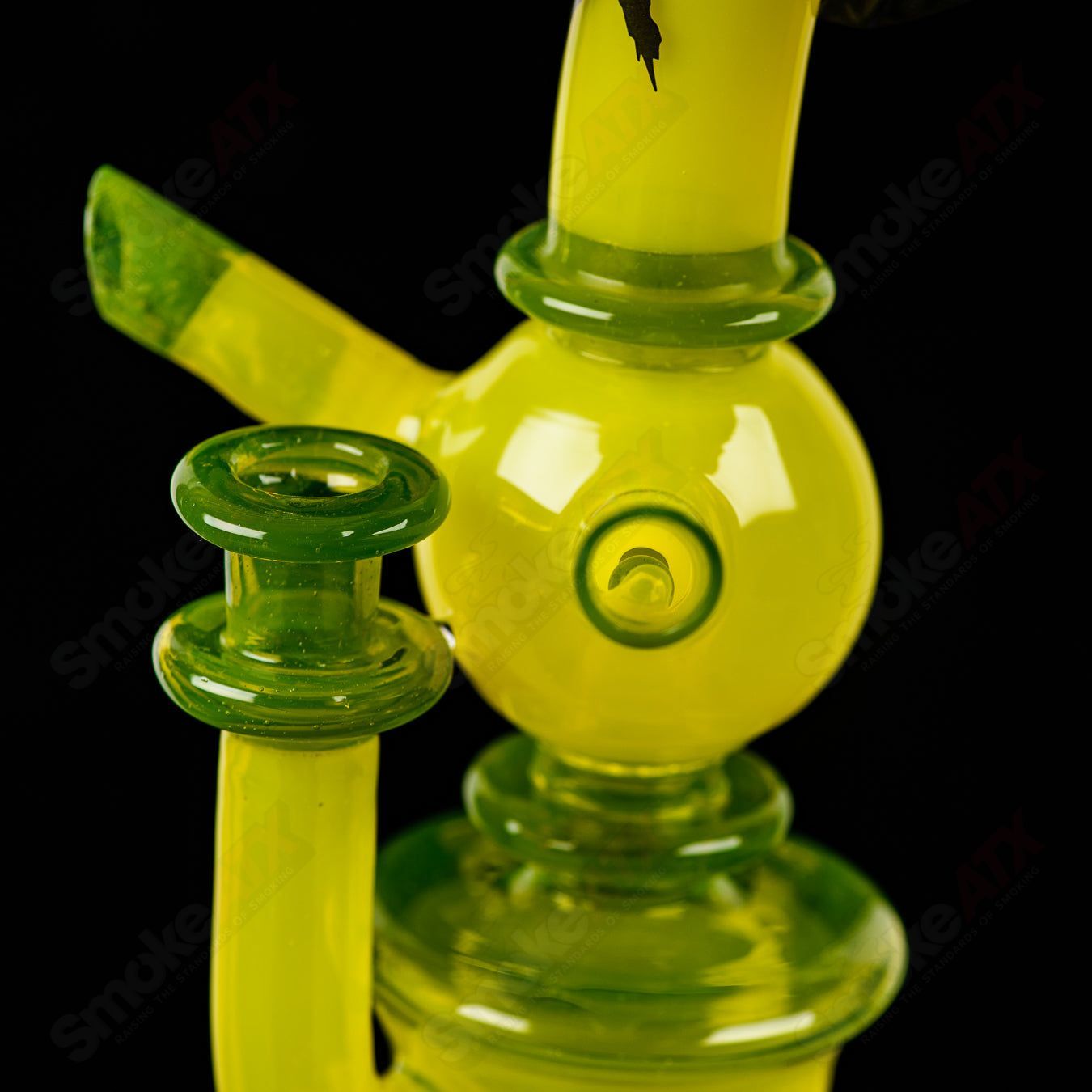 Colorful RAM Xhalerator concentrate rig by Robert Mickelsen, featuring intricate glass art and vibrant colored accents.