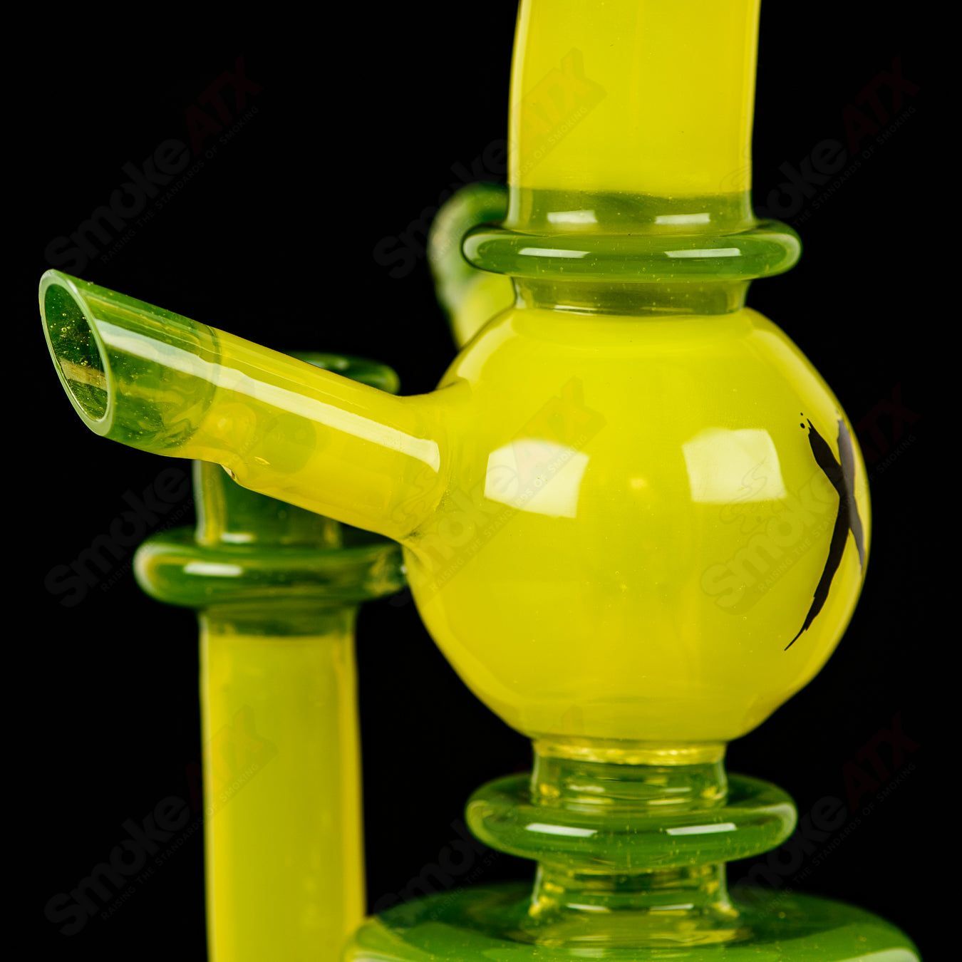 Colorful Xhalerator RAM Robert Mickelsen glass concentrate rig with intricate design and vibrant glasswork.