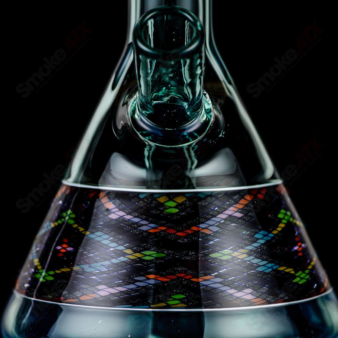 John W Glass Filla Tube, a heady glass concentrate rig with intricate designs and clear glass construction.
