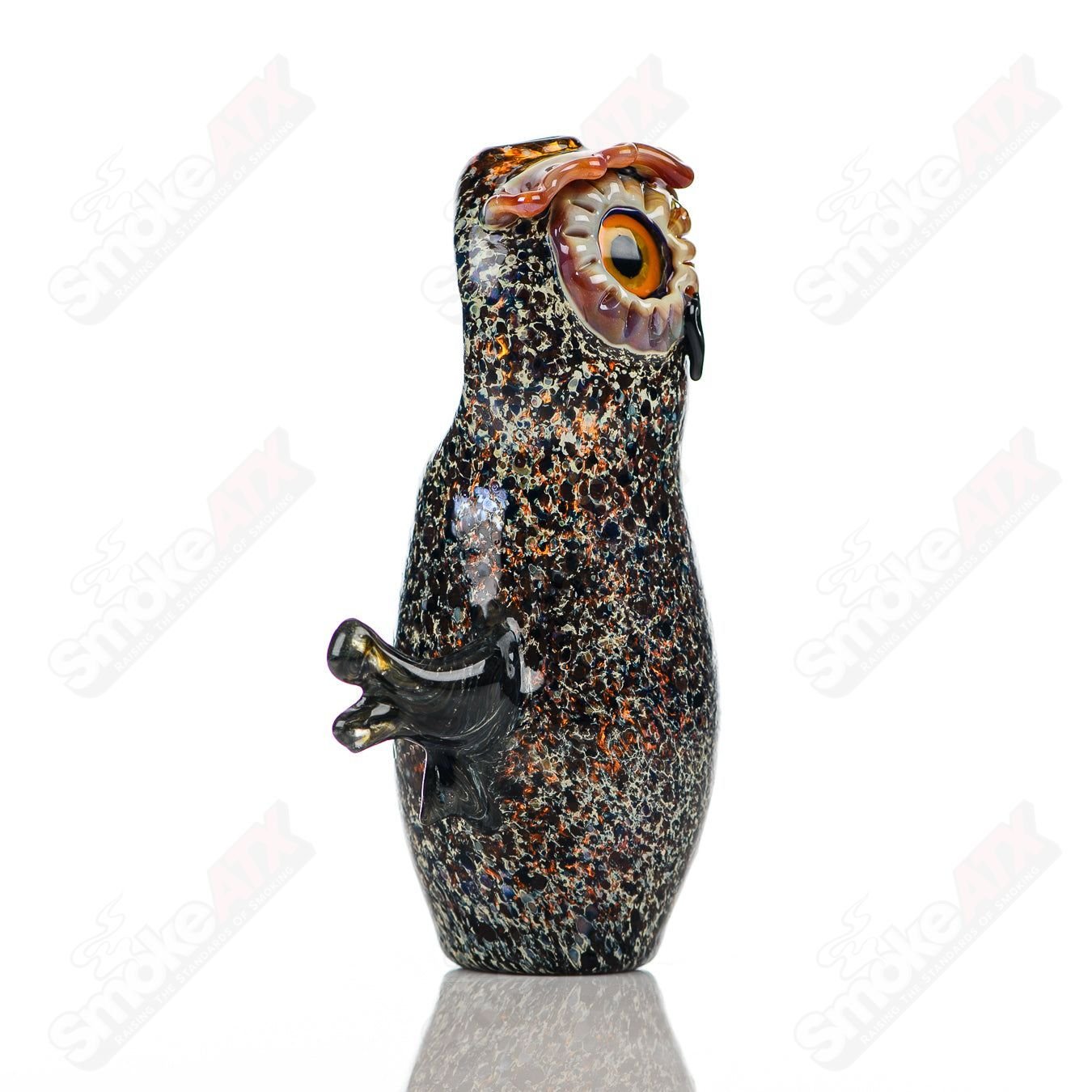 Glass pipe from Four Winds Flameworks, Hooter Four Winds model, featuring intricate glasswork and a compact design.