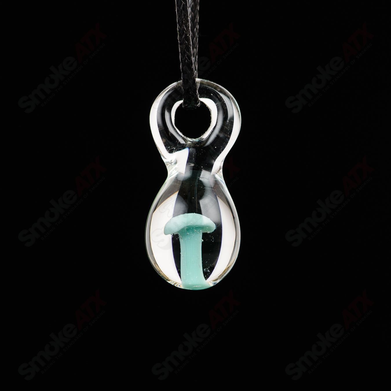 C4K Glass Implosion Pendant made of colorful C4K glass with intricate swirling patterns, hanging from a silver chain.